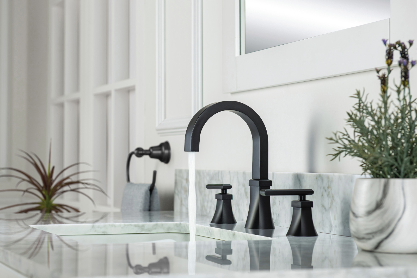 matte black faucet on white granite